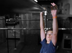 A man is doing an exercise in the gym.