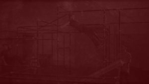 A red background with some type of structure in the middle