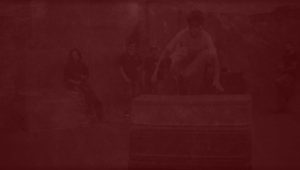 A red background with people sitting on it.