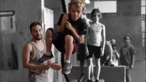 A man and boy are playing with a rope.