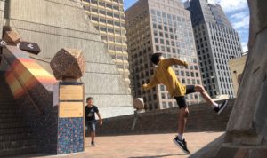 A man jumping in the air with a tennis racket.